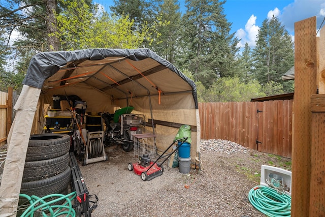 view of outbuilding with fence