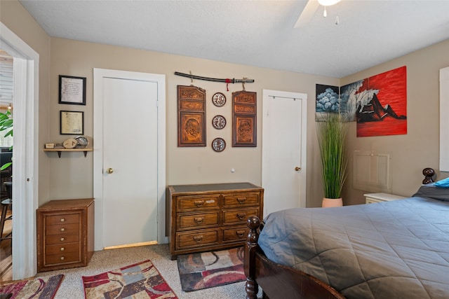 carpeted bedroom featuring ceiling fan