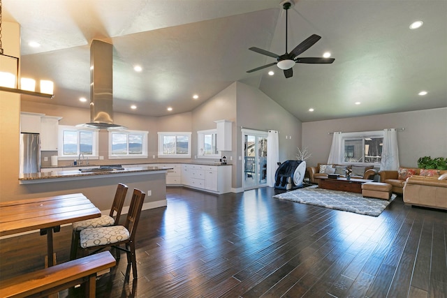living area featuring a ceiling fan, high vaulted ceiling, recessed lighting, and dark wood-style floors