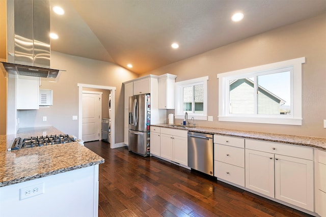 2626 Muirfield Ct, Missoula, MT 59808 - kitchen featuring stainless steel appliances, island range hood, dark wood-style flooring, light stone countertops, and lofted ceiling