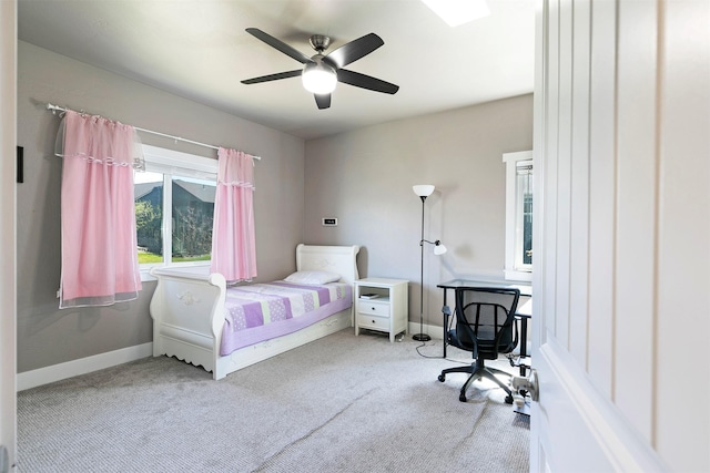bedroom with baseboards, carpet, and ceiling fan