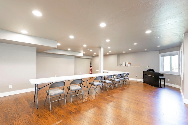 kitchen featuring baseboards, recessed lighting, and wood finished floors