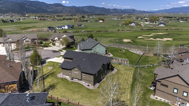 bird's eye view featuring view of golf course and a mountain view