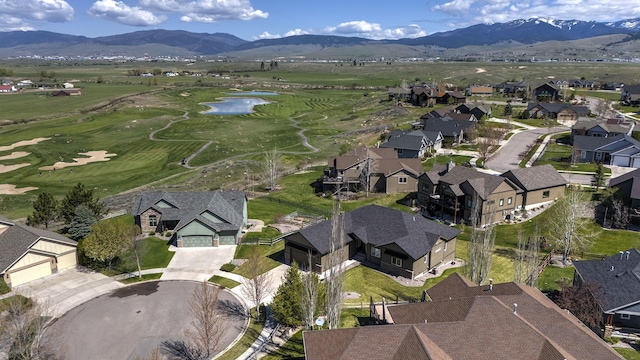 birds eye view of property featuring a residential view and a water and mountain view