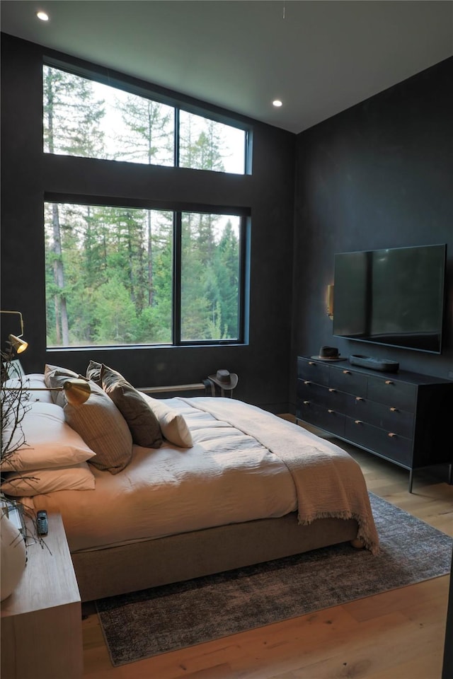 bedroom featuring light wood-style floors and recessed lighting