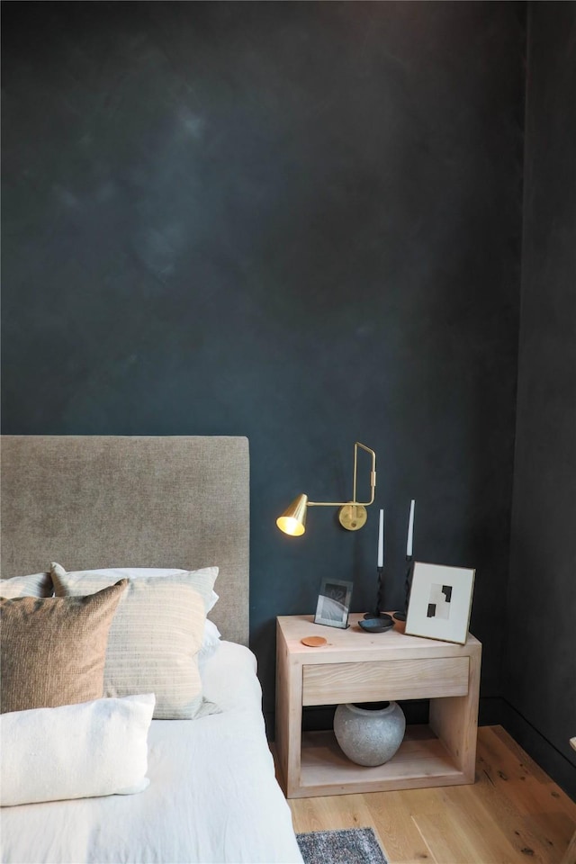 bedroom featuring wood finished floors