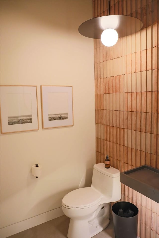 bathroom with tile patterned flooring and toilet