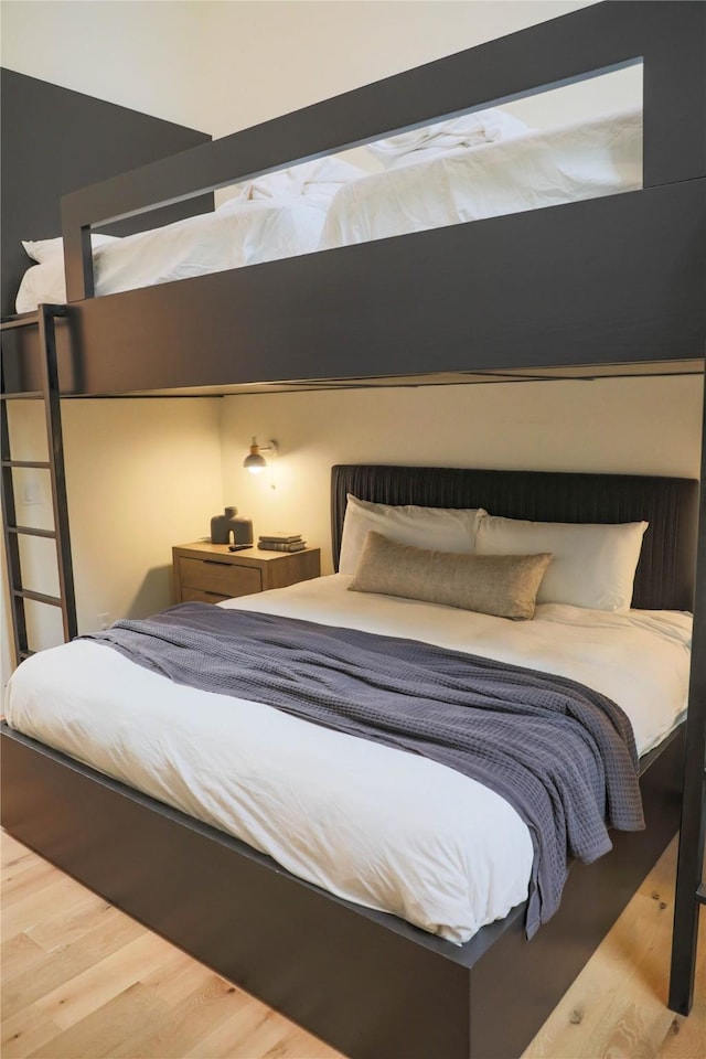 bedroom featuring wood finished floors