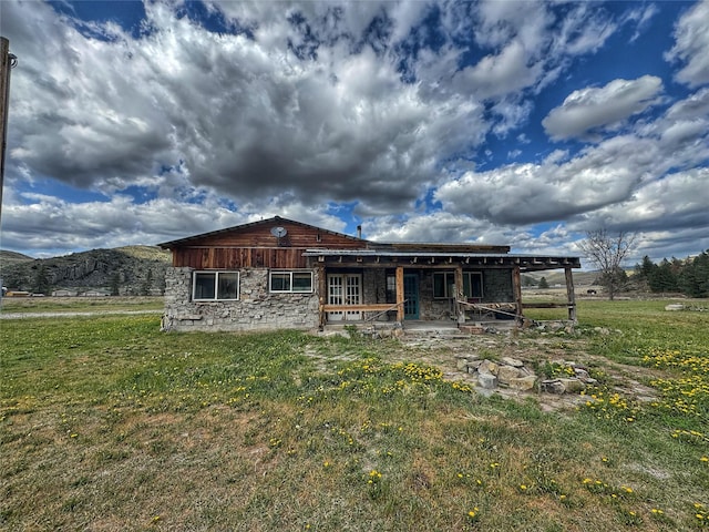9536 Mt Highway 200, Plains, MT 59859 - back of property with a lawn and stone siding