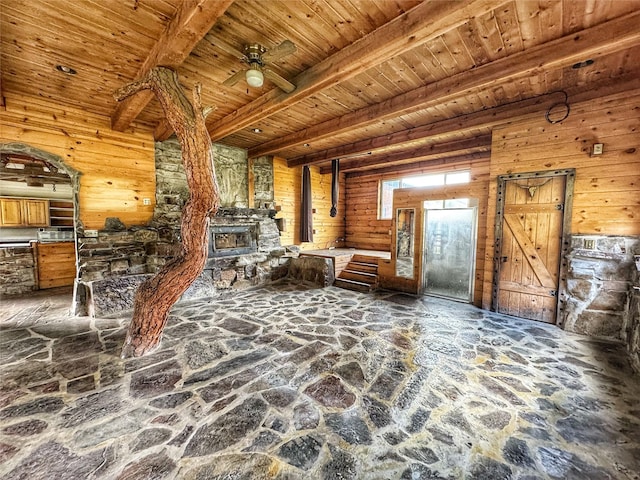 9536 Mt Highway 200, Plains, MT 59859 - living room featuring stone flooring, beam ceiling, and wood ceiling