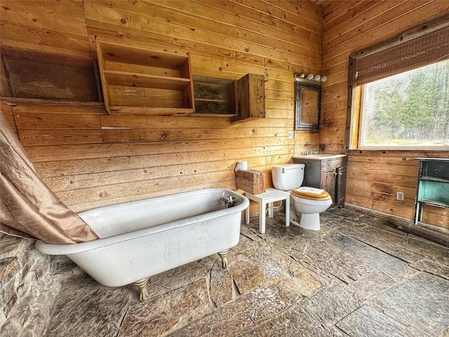 9536 Mt Highway 200, Plains, MT 59859 - bathroom with stone finish flooring, toilet, and a soaking tub