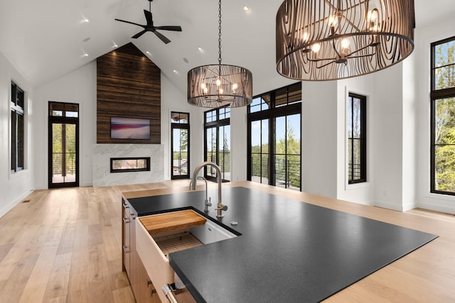 176 S Shooting Star Cir, Whitefish, MT 59937 - kitchen with open floor plan, high vaulted ceiling, plenty of natural light, wood finished floors, and recessed lighting