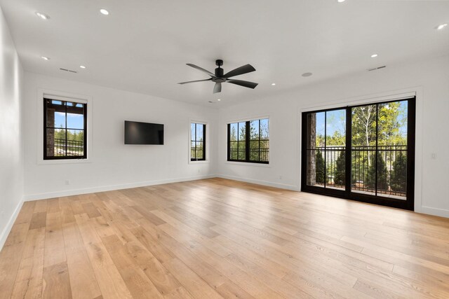 spare room with baseboards, recessed lighting, light wood finished floors, and ceiling fan