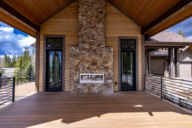 176 S Shooting Star Cir, Whitefish, MT 59937 - wooden deck with an outdoor stone fireplace