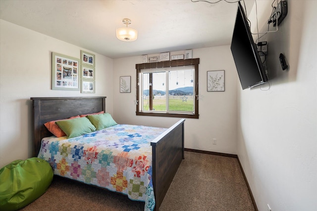 bedroom featuring carpet floors and baseboards