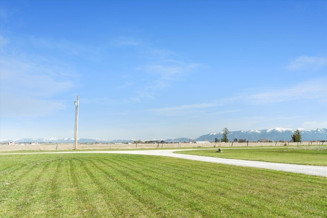 view of yard featuring a rural view and a mountain view