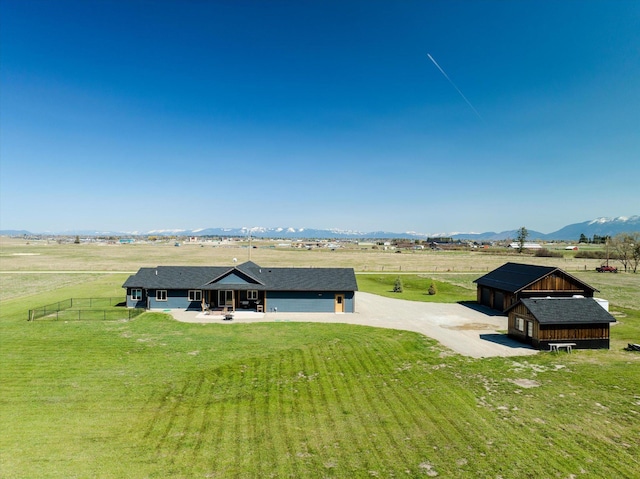 bird's eye view featuring a rural view and a mountain view