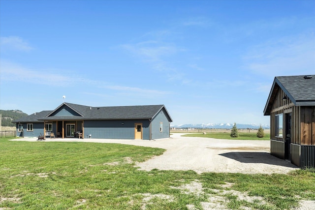 2449 Airport Rd, Kalispell, MT 59901 - back of house featuring a patio and a yard