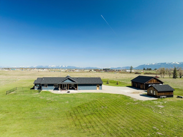 drone / aerial view featuring a mountain view and a rural view
