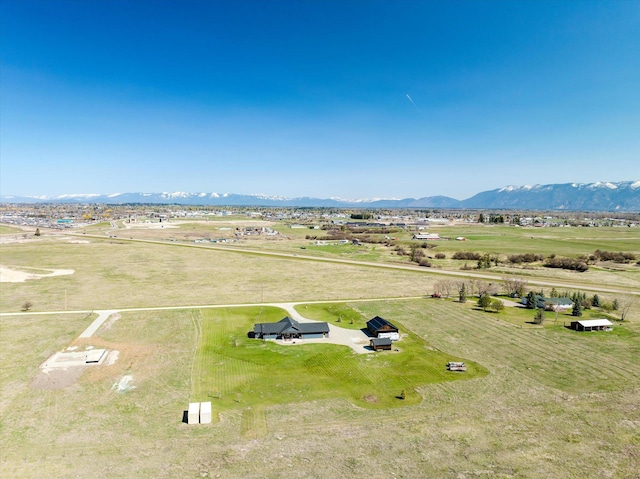 birds eye view of property with a mountain view and a rural view