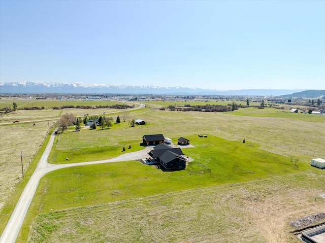 drone / aerial view featuring a mountain view and a rural view