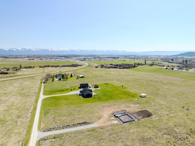 drone / aerial view with a mountain view and a rural view