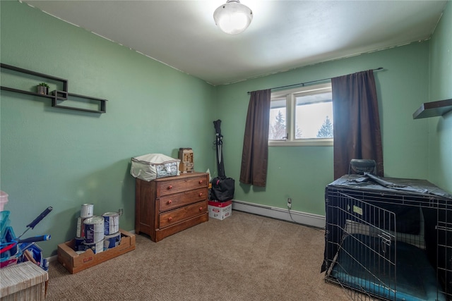 bedroom with baseboard heating, carpet flooring, and baseboards