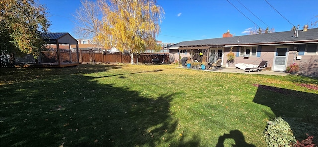 view of yard featuring a patio area and a gazebo