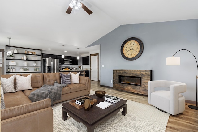 1521 Cheery Dr, Belgrade, MT 59714 - living room featuring ceiling fan, light wood-style floors, recessed lighting, lofted ceiling, and a high end fireplace
