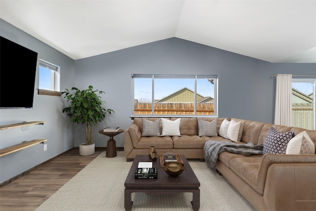 1521 Cheery Dr, Belgrade, MT 59714 - living room with plenty of natural light, wood finished floors, and lofted ceiling