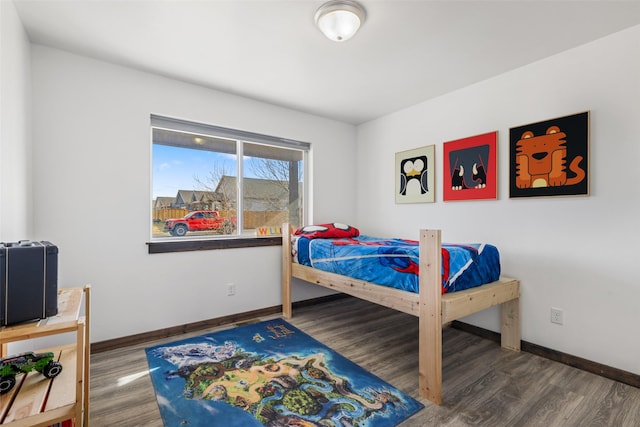 1521 Cheery Dr, Belgrade, MT 59714 - bedroom featuring baseboards and wood finished floors
