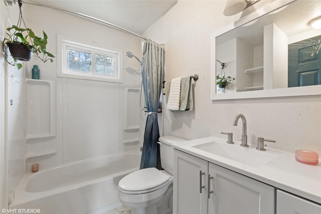 full bathroom featuring toilet, shower / bath combination with curtain, and vanity