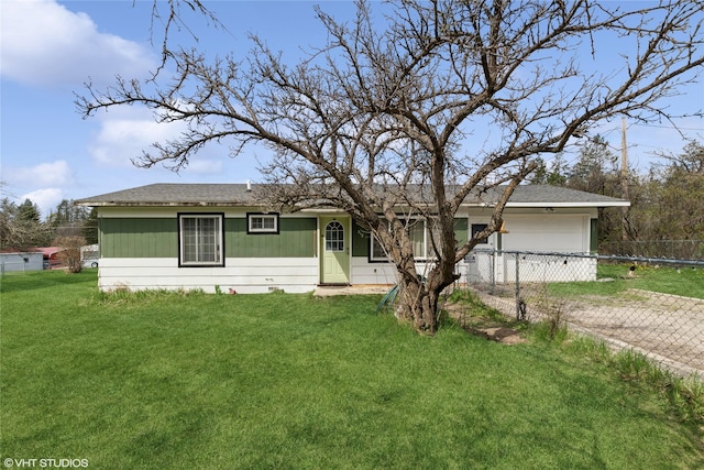 view of front of property with a garage, fence, driveway, and a front yard