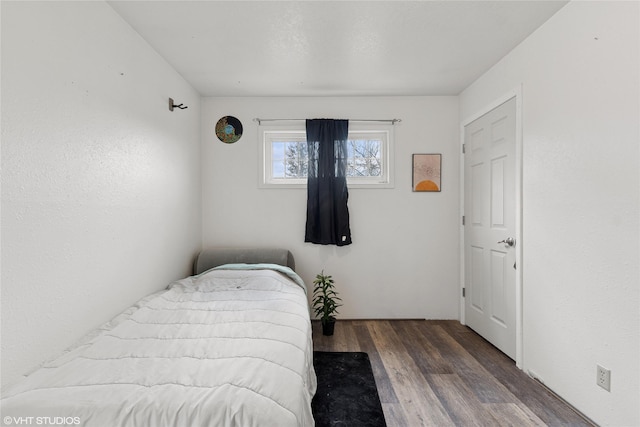 bedroom featuring wood finished floors