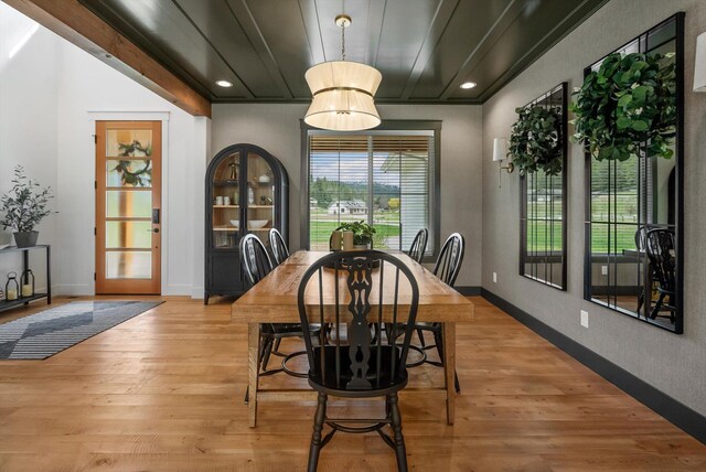 dining space featuring recessed lighting and light wood-style flooring