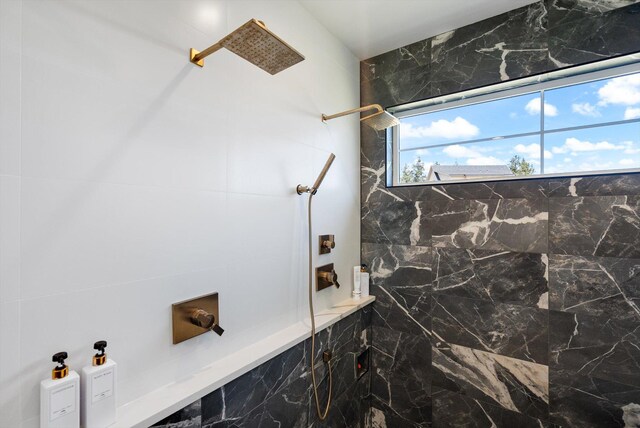 bathroom with tiled shower