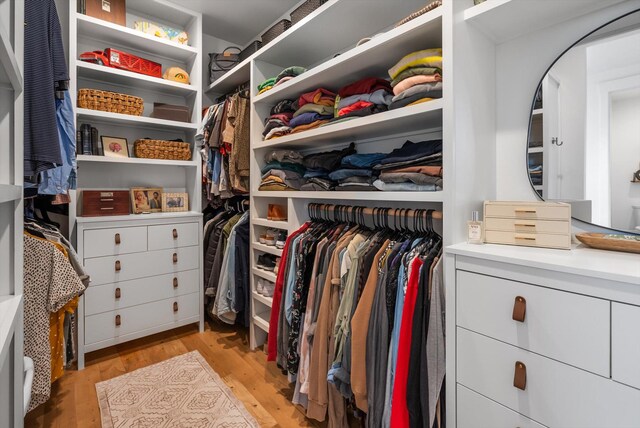 walk in closet featuring light wood finished floors
