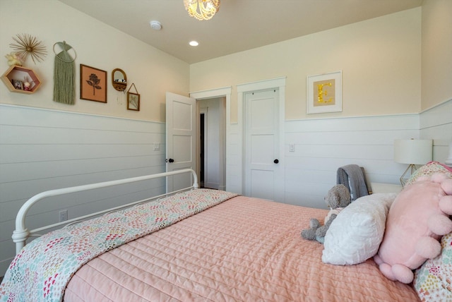 1007 Pheasant Ridge Dr, Kalispell, MT 59901 - bedroom with a wainscoted wall and recessed lighting