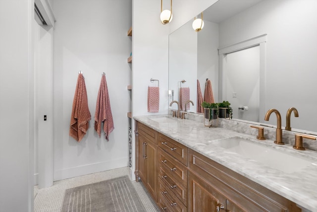bathroom featuring a sink and double vanity