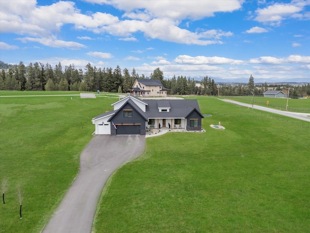 1007 Pheasant Ridge Dr, Kalispell, MT 59901 - view of front facade featuring a garage, a front lawn, and driveway