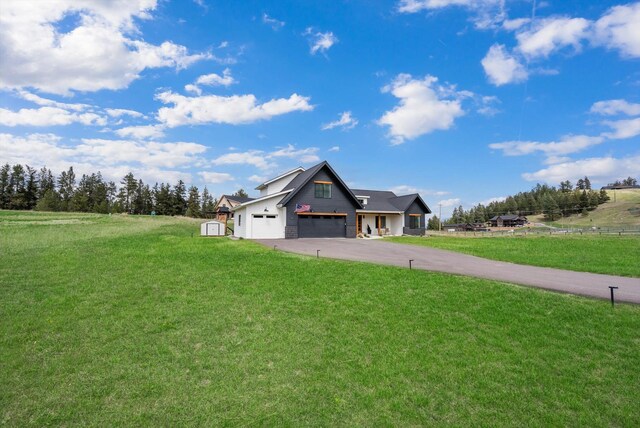 view of front of property with driveway and a front yard