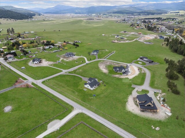 birds eye view of property with a mountain view