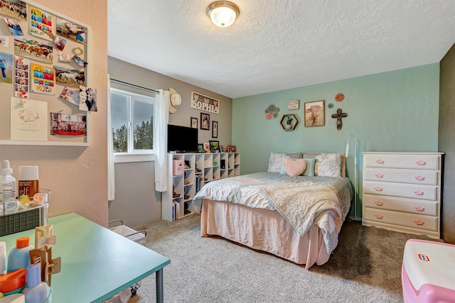 carpeted bedroom featuring a textured ceiling