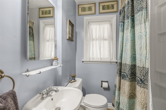2908 6th Ave S, Great Falls, MT 59405 - bathroom with toilet, curtained shower, and a sink