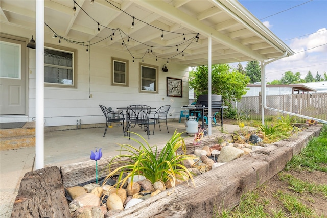 2908 6th Ave S, Great Falls, MT 59405 - view of patio featuring fence, outdoor dining area, and area for grilling