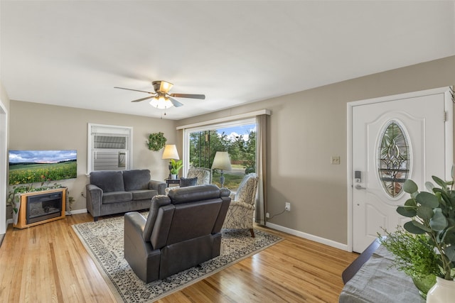 2908 6th Ave S, Great Falls, MT 59405 - living area featuring baseboards, ceiling fan, a fireplace, and light wood finished floors