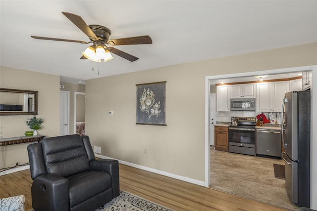 2908 6th Ave S, Great Falls, MT 59405 - living area with baseboards, ceiling fan, and light wood-type flooring