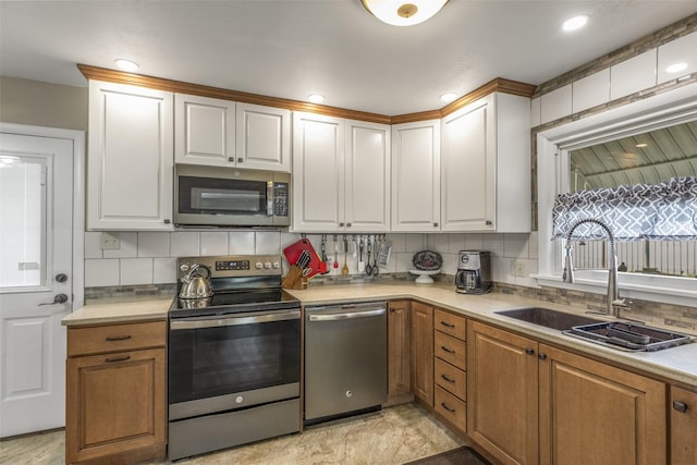2908 6th Ave S, Great Falls, MT 59405 - kitchen featuring light countertops, a sink, tasteful backsplash, and stainless steel appliances