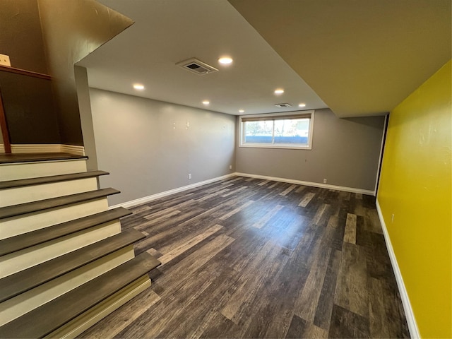 basement featuring recessed lighting, baseboards, wood finished floors, visible vents, and stairway