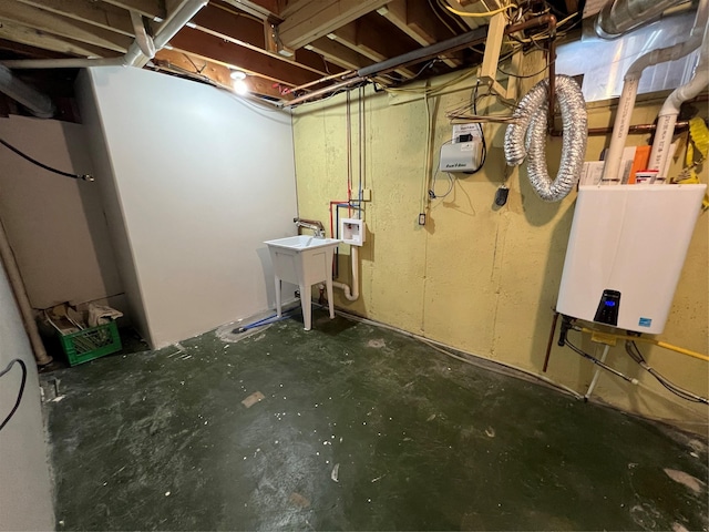 unfinished below grade area with a sink and tankless water heater